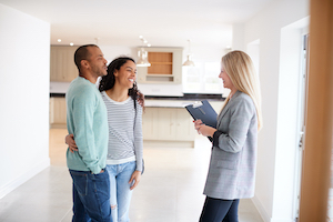 Showing agent touring the home with potential home buyers